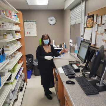 Pharmacy worker filling a prescription